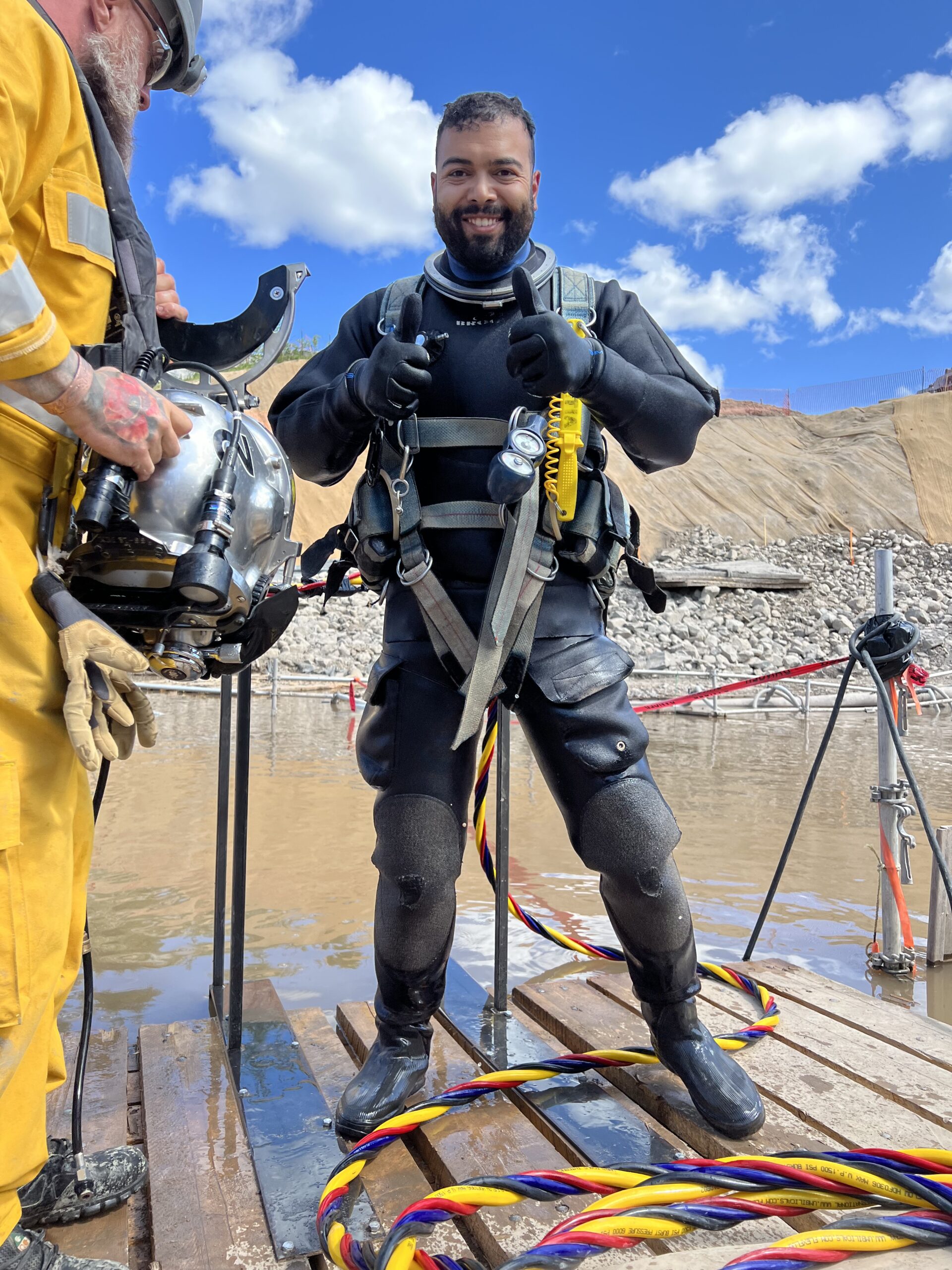 Commercial diving team preparing reinforcement and anchors for underwater concrete