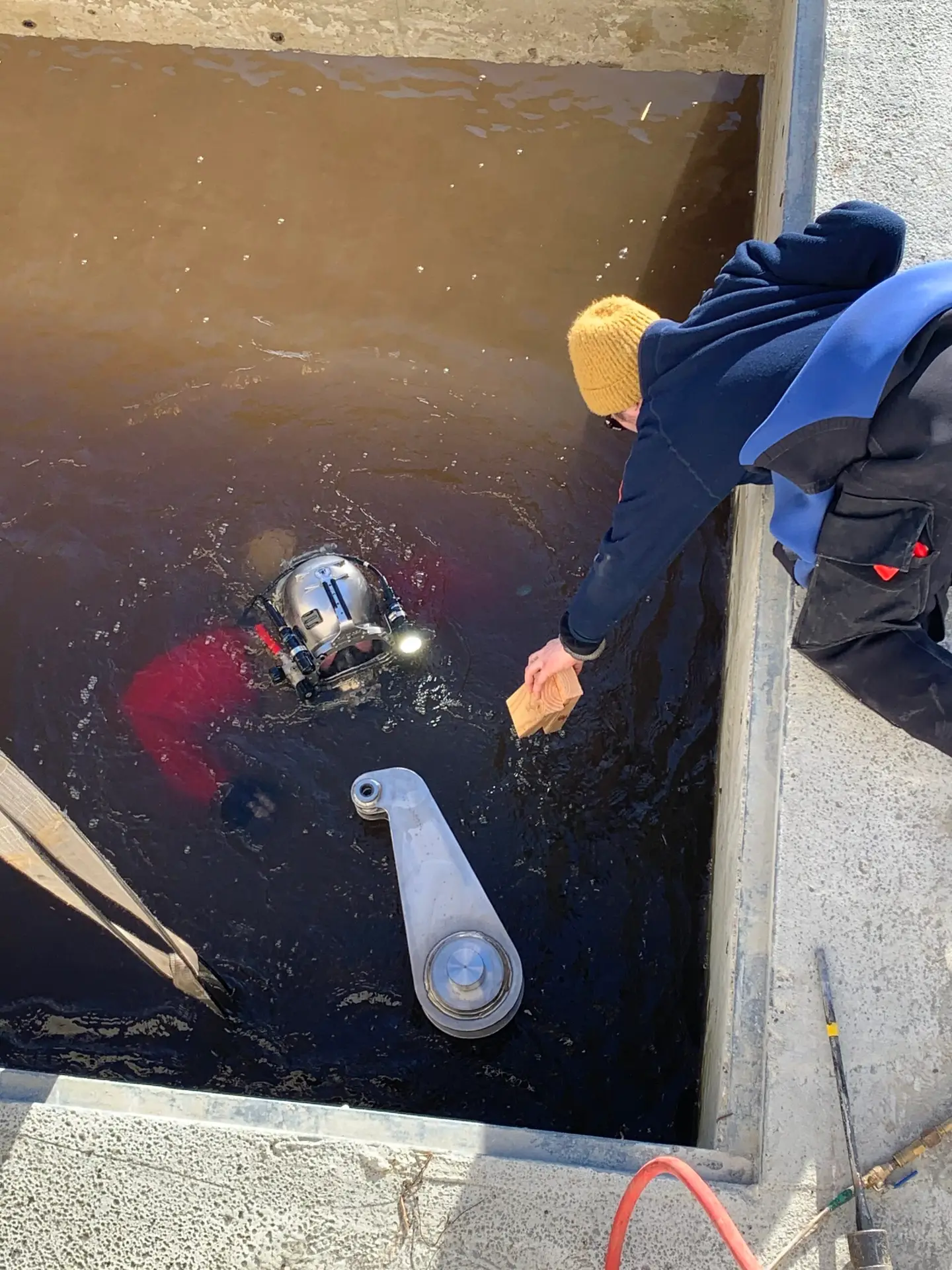 Confined Space Operations diver entering a restricted underwater structure