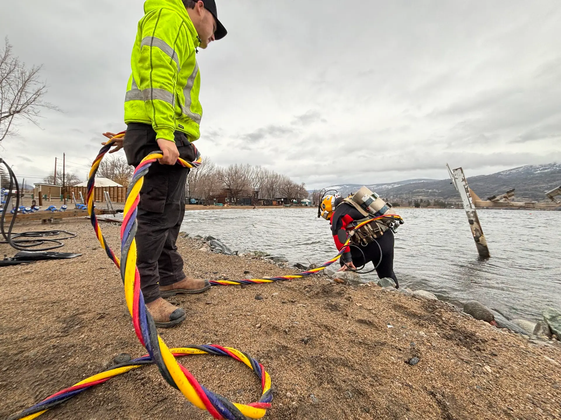 Commercial diver entering water for hydro infrastructure inspection