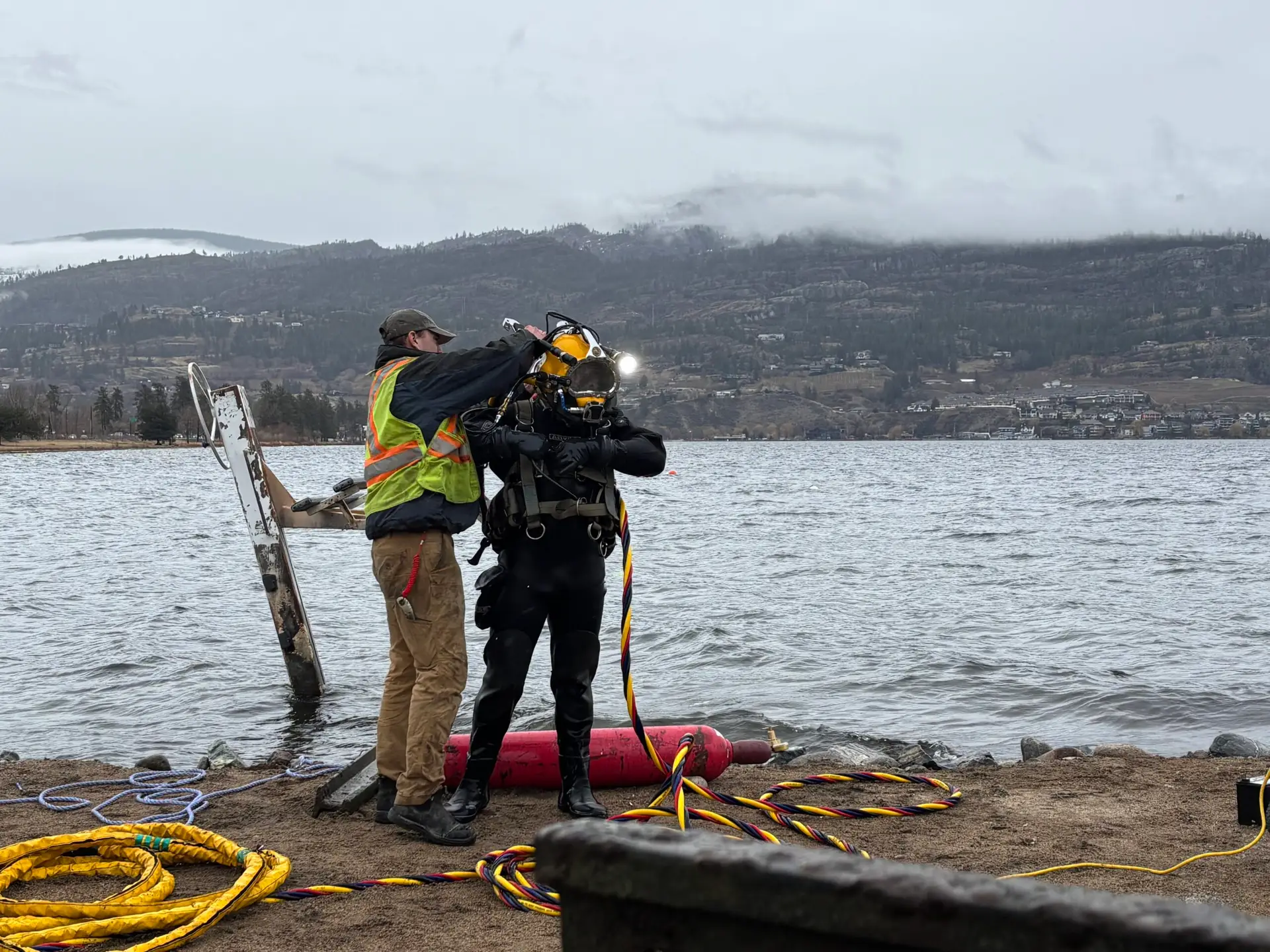 Underwater Welding tradesperson-diver completing equipment checks before work