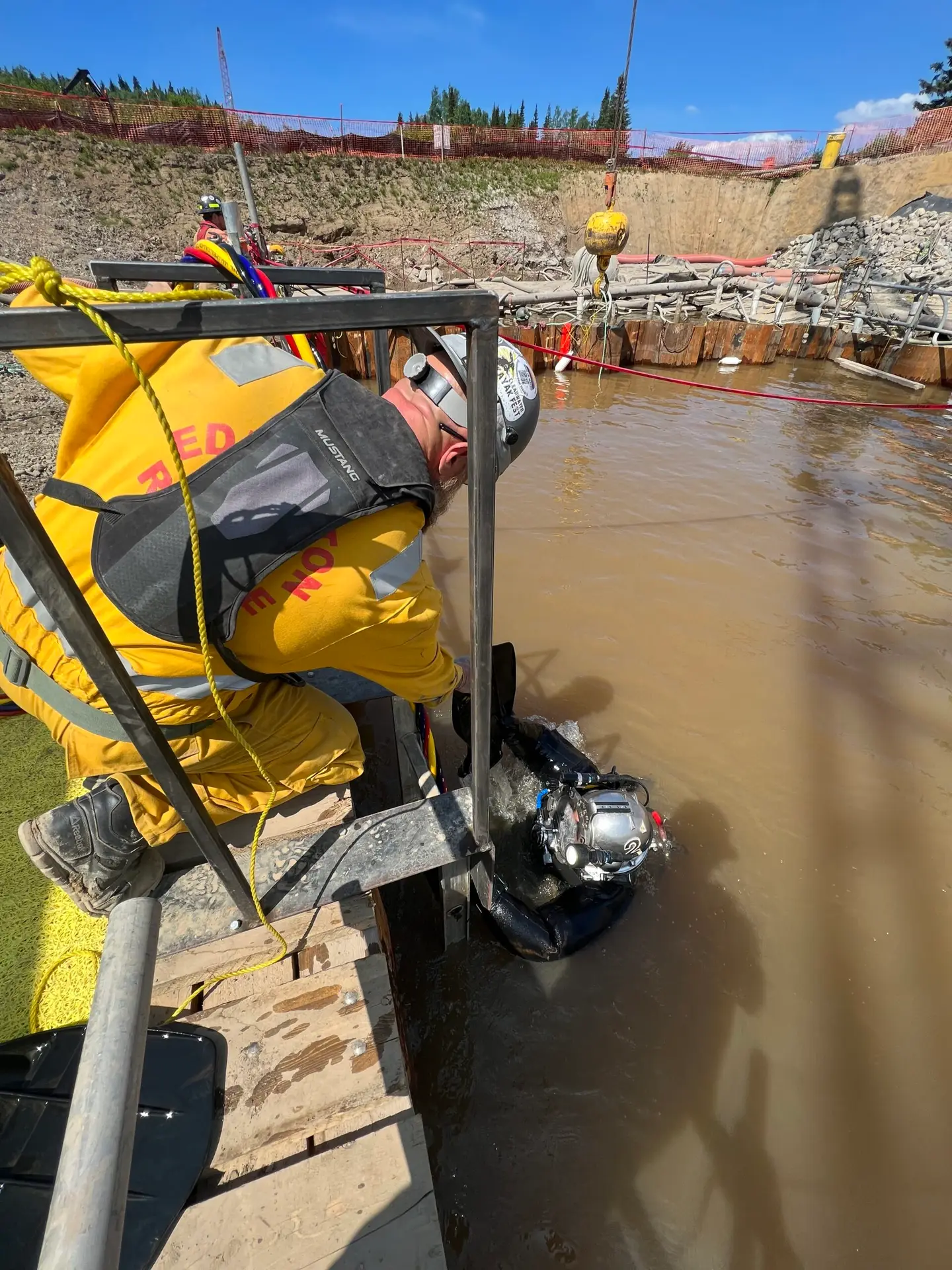 Commercial diver inspecting sacrificial anodes on submerged steel